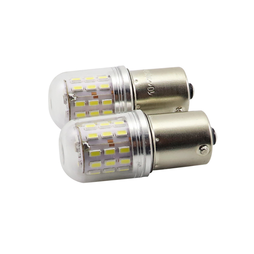 Two G18 BA15s LED miniature globe bulbs studio close-up view