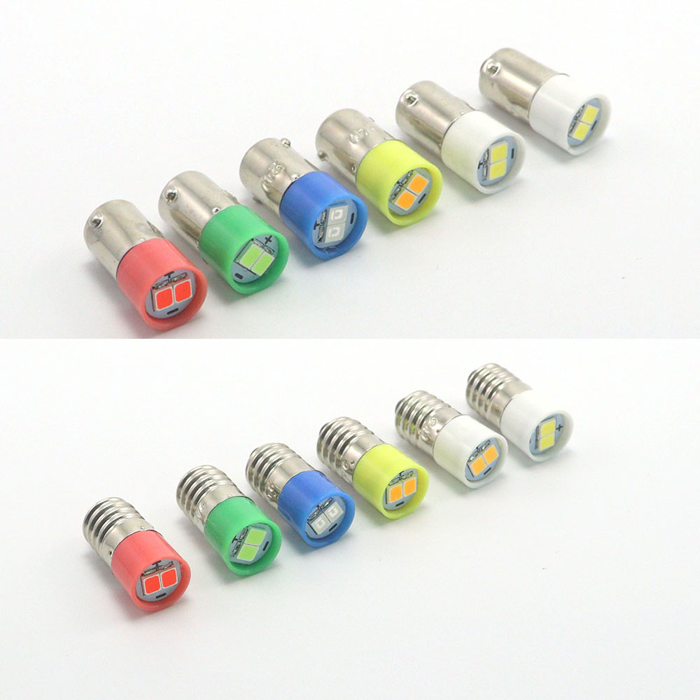 Pair of 23mm BA9s T4W LED indicator bulbs demonstrating compact form factor