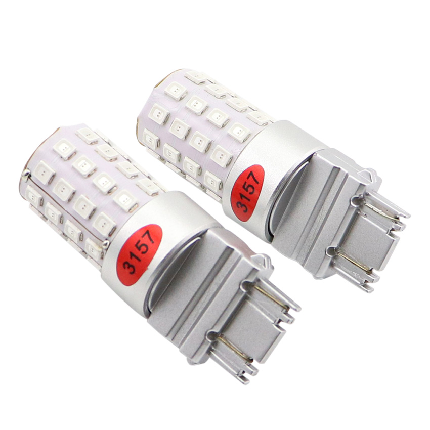 3157 P27/7W LED dual filament bulb studio perspective showing 45-emitter radial layout and unibody aluminum pillar
