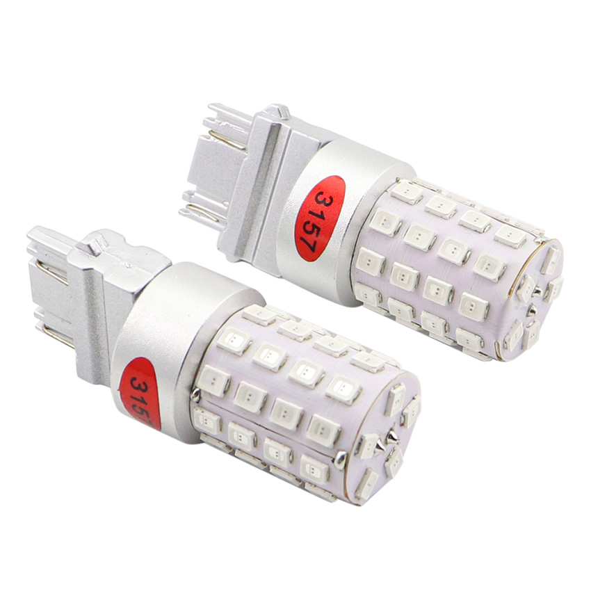 3156 3157 LED wedge base automotive bulbs pair angled profile displaying precision CNC heat sink construction